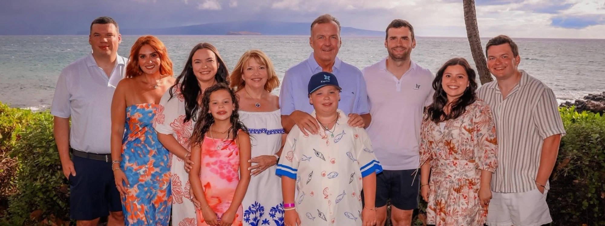 The Egan family together outdoors by the ocean
